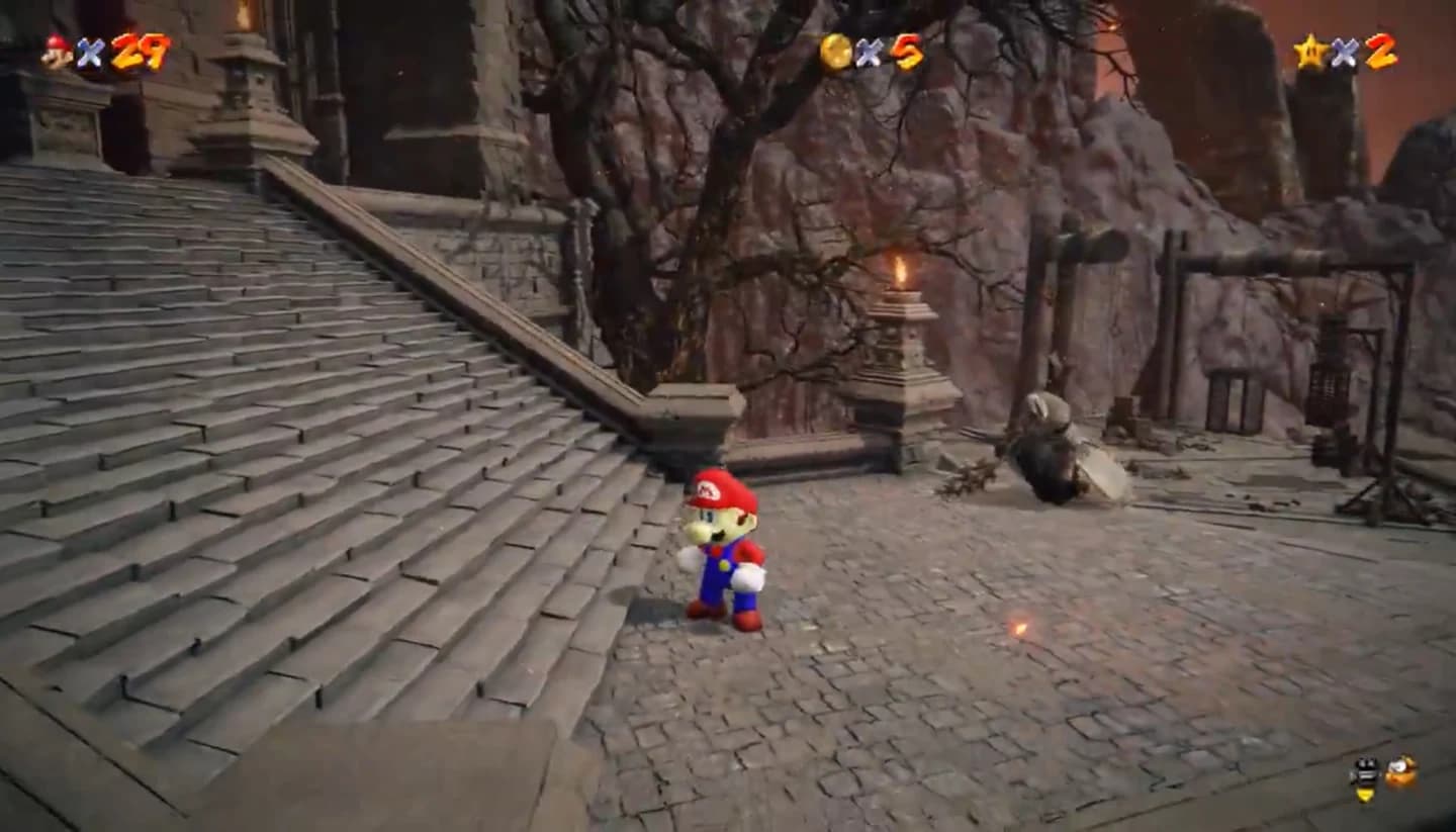 Super Mario 64’s Mario stands beside a stone staircase at Volcano Manor in Elden Ring. His lives, coins, and stars appear across the top.